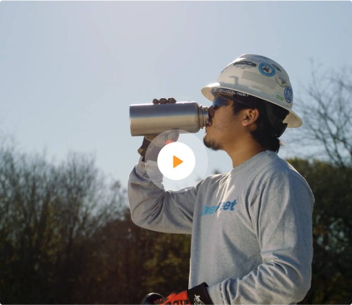 Waterfleet employee drinking water