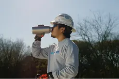 Waterfleet employee drinking water